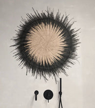 Load image into Gallery viewer, One Usiku Woven Wall Art pieces with a natural enter and black indigo edging. Displayed on a wall with black coat hangers.
