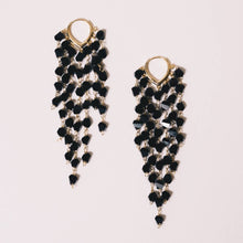 Load image into Gallery viewer, Black Crystal Drop Earrings. 18K gold huggies hoop support 7 strands of crystals at varying lengths. 3 inch length
