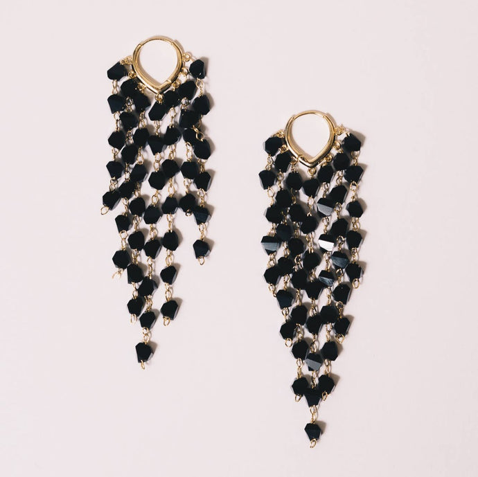 Black Crystal Drop Earrings. 18K gold huggies hoop support 7 strands of crystals at varying lengths. 3 inch length